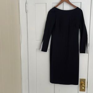 Banana Republic. Knee length black dress with flair!